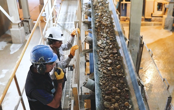 Silver mining employees wearing protective gear.